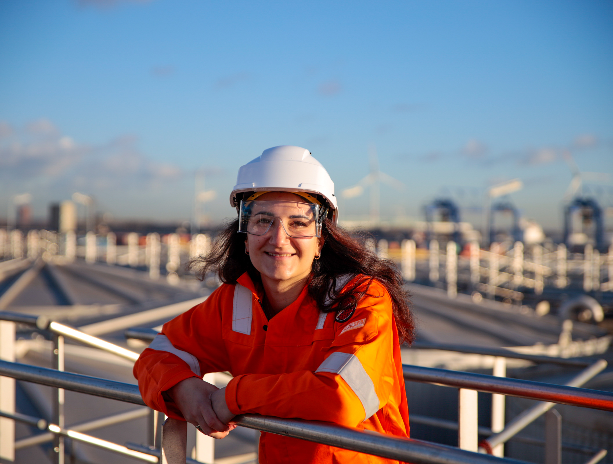 Employee wearing safety clothing and equipment